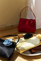 Red Tuscan Rose silk handbag, a stylish shoulder bag by Not Just Pajama featuring elegant design and smooth fabric.
