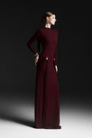 Red Avielle draped floor-length gown by Maison Des Copains, elegant evening dress with flowing fabric and sophisticated design.
