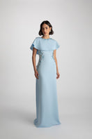 Elegant Jade gown by Raishma featuring flowing fabric and intricate detailing, perfect for formal occasions.
