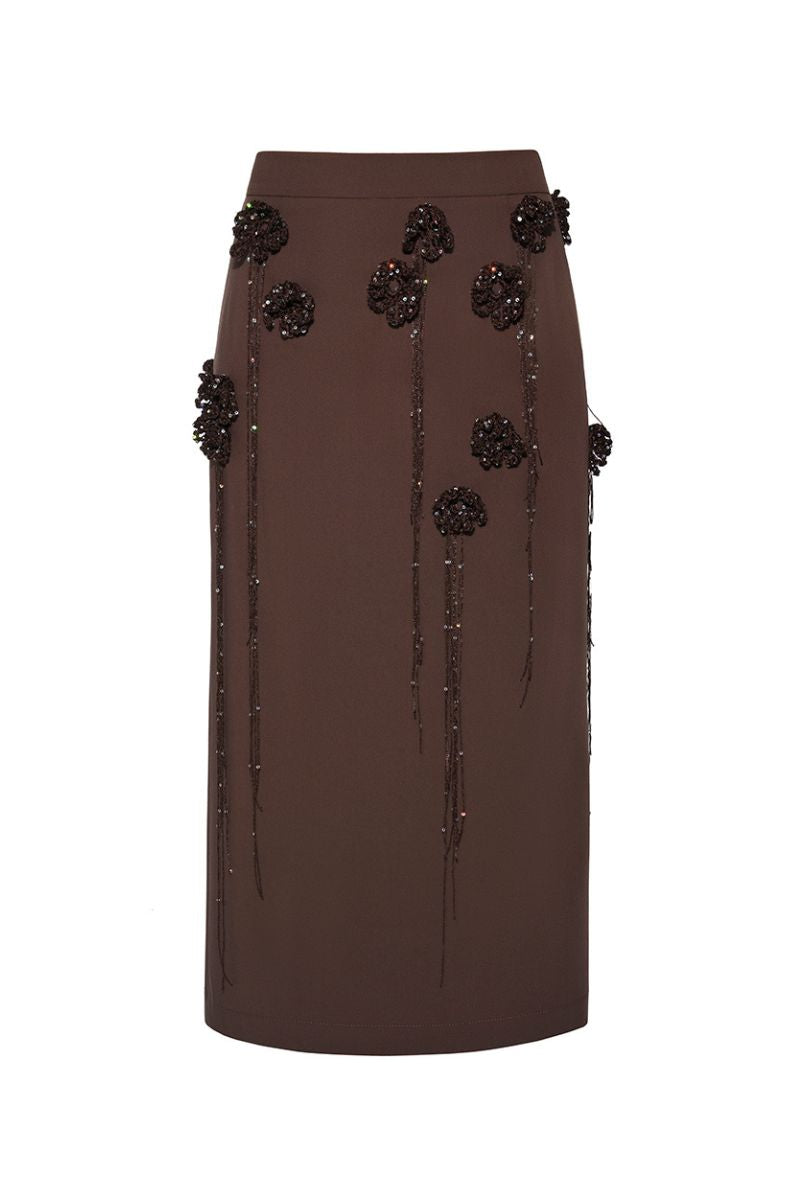 Lalo maxi skirt with knitted flower embellishments, featuring a pencil silhouette and elegant design.
