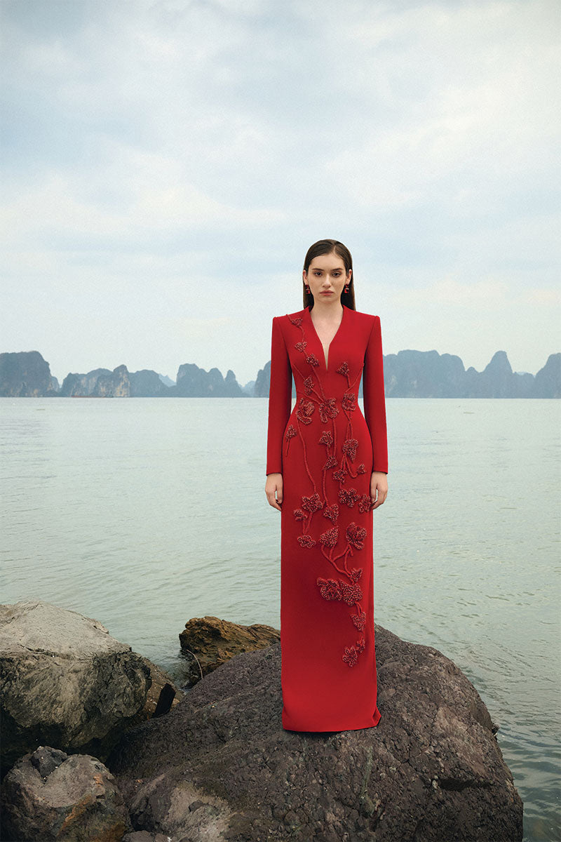 Lune De Soie velvet satin gown with elegant draping and long sleeves, perfect for formal occasions.
