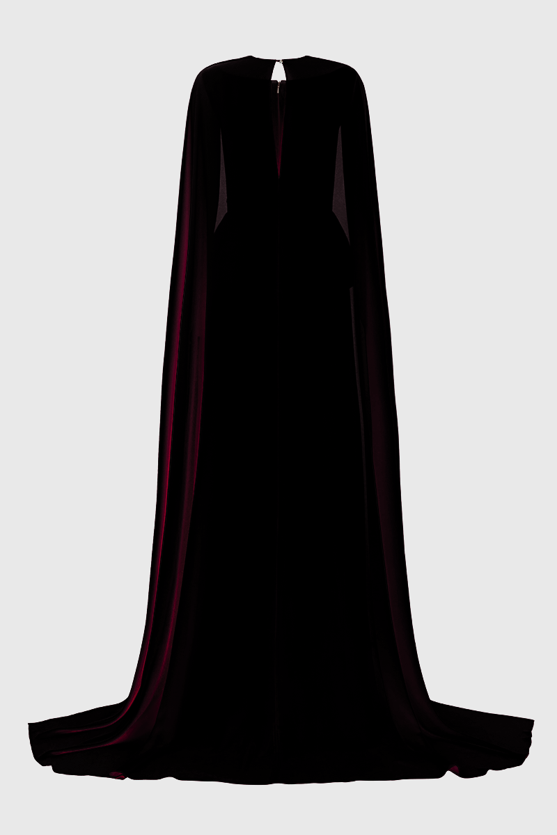 Elegant Lune De Soie ruched silk gown with flowing fabric and intricate draping, displayed on a mannequin.