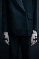 Black distressed Vaska jacket with a rugged, worn-in look, featuring frayed edges and a casual fit.