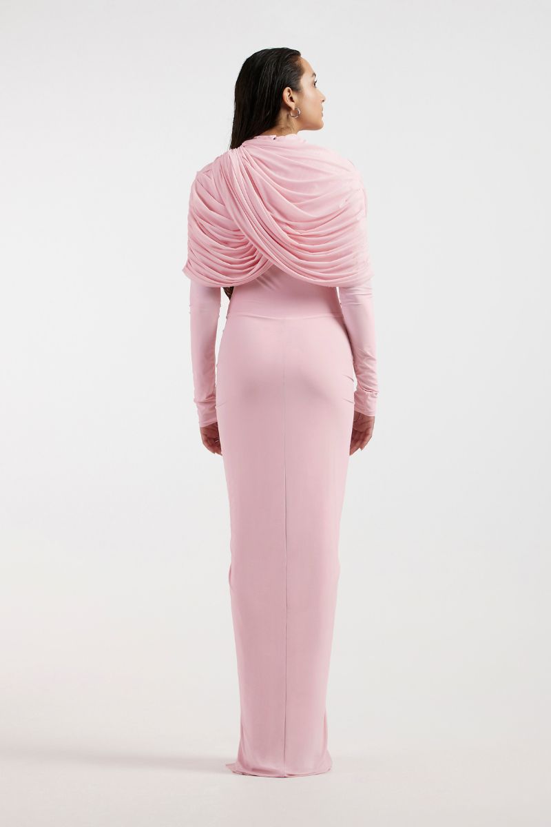 Deme By Gabriella pink draped gown with flowing fabric and elegant design, shown on a model in a formal setting.