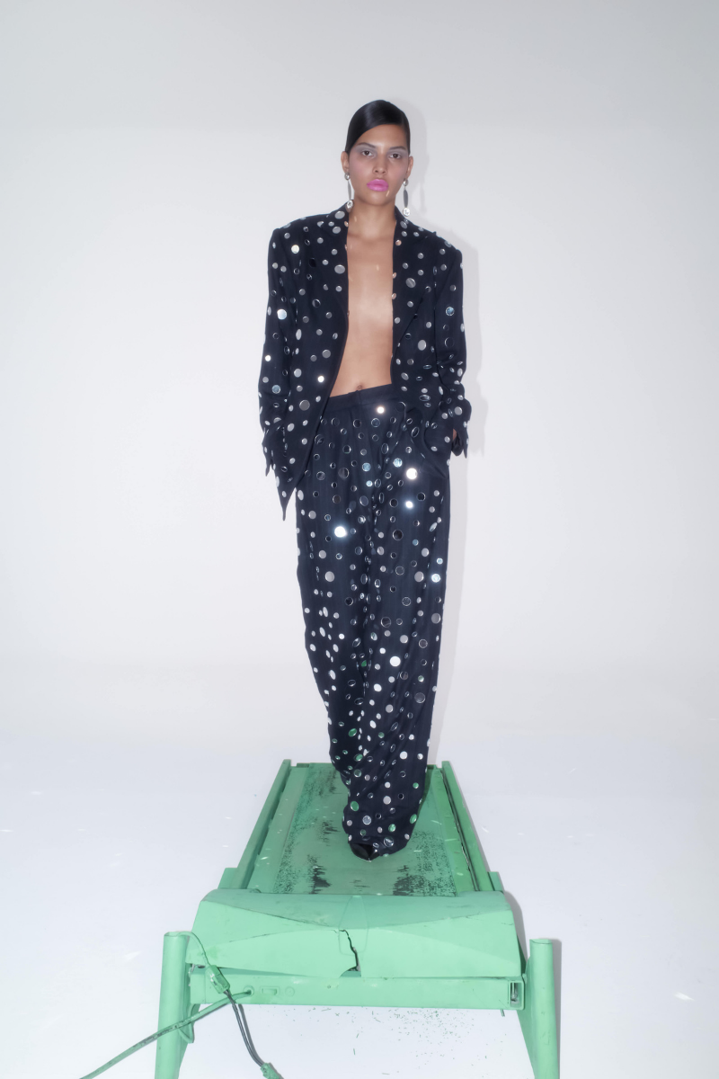 Sudi Etuz mirror-covered straight cut pants showing reflective metallic fabric and tailored fit on a white background.