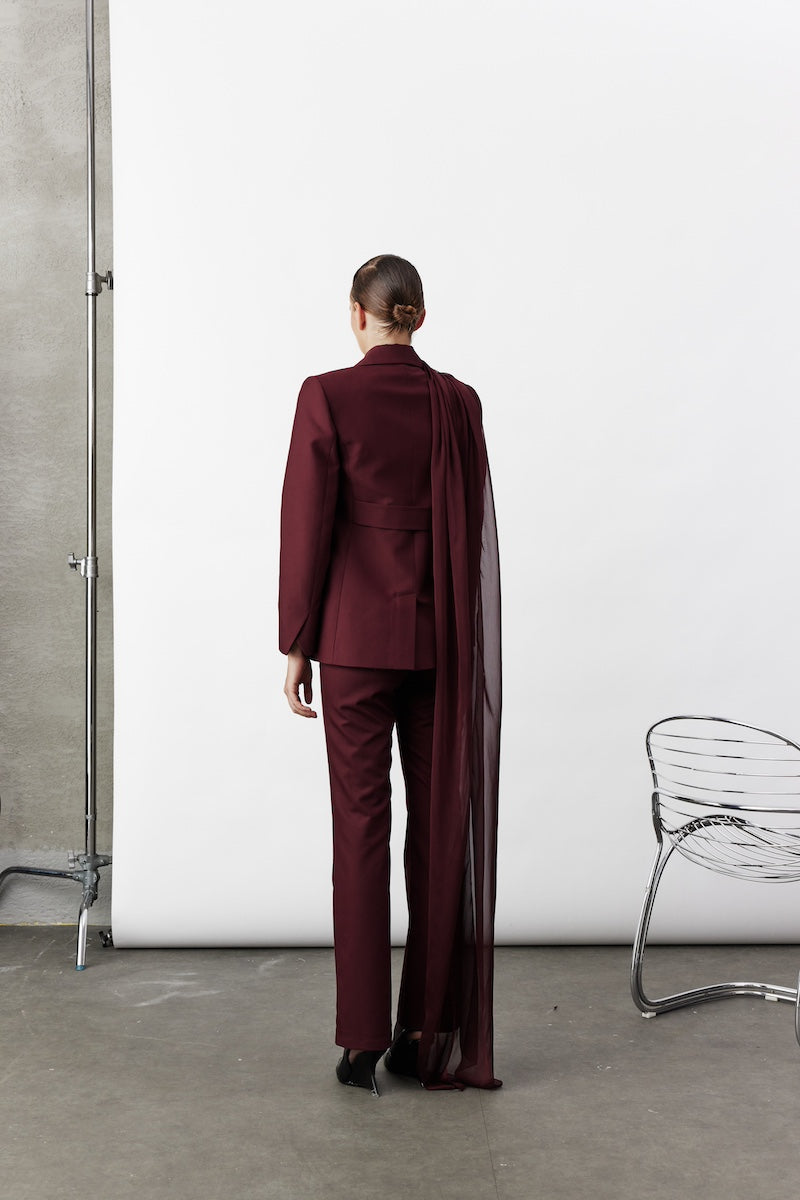 Nazlı Ceren Elodie Bordeaux jacket displayed on a hanger, showcasing its stylish design and rich burgundy color.
