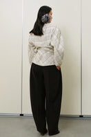 LECIA twisted plaid top featuring a stylish design, long sleeves, and a modern fit, perfect for casual and trendy outfits.