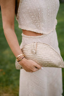 Adriana Castro LA BARCA MINI leather clutch in gold with sleek design and compact size, perfect for elegant occasions.