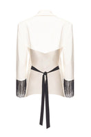 Vaska white blazer with beaded fringe detailing, tailored fit, and stylish design perfect for elegant occasions.