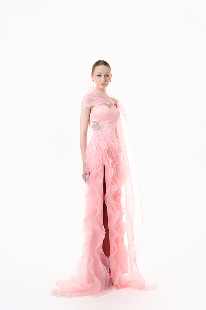 Blush pink draped ruffle gown by Happy Clothing featuring elegant fabric and flowing design with ruffle details.