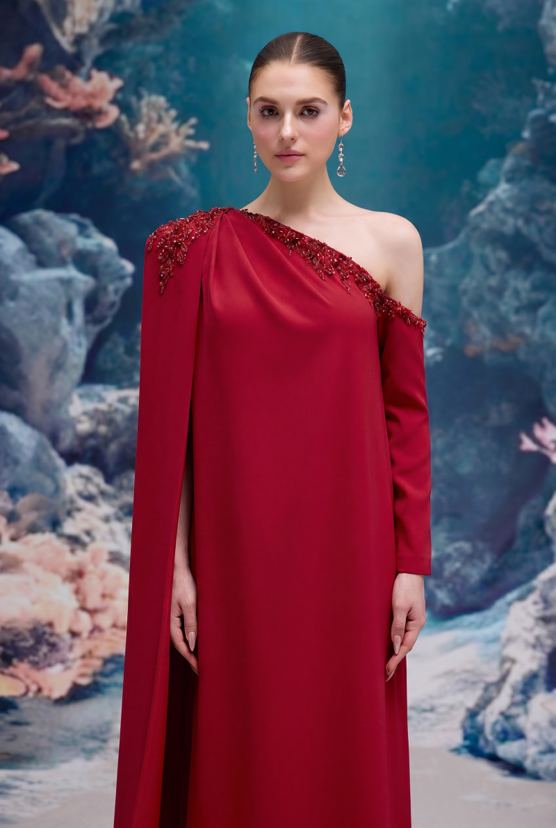 Red LINNEA CREPE gown by 21Six, featuring elegant design and flowing fabric, perfect for formal occasions.