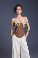 Brown bouquet corset top by Keira Tong featuring floral print and fitted design, shown on a model.