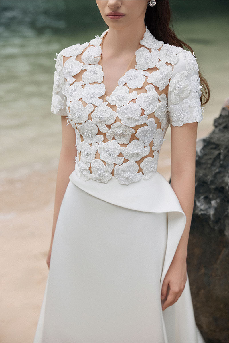 White satin taffeta gown by Lune De Soie, featuring elegant flowing fabric and intricate design details.