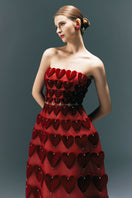 HAPPY CLOTHING CULT MIA X Burgundy gown with embellished heart motif, flowing fabric, and elegant design.
