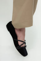 Christin Wu Annaya flats in black leather, stylish slip-on shoes with a sleek design and rounded toe.