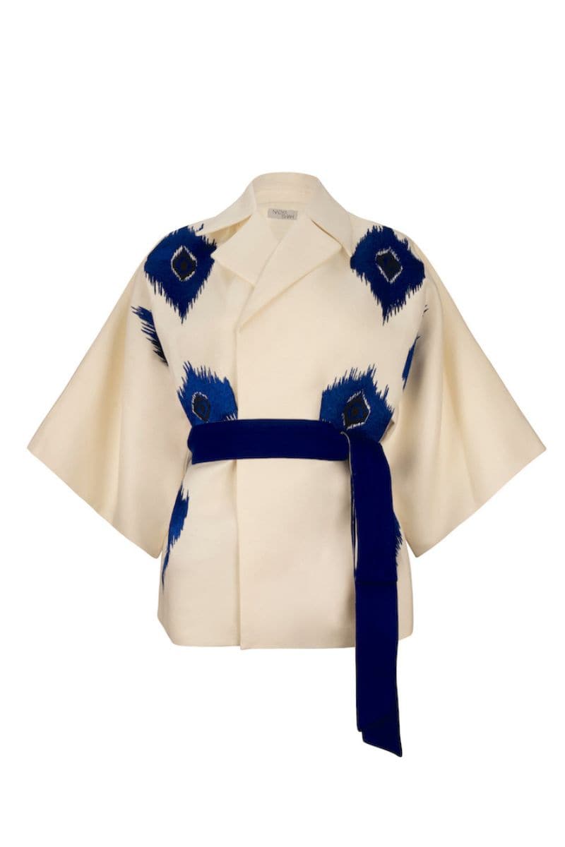 Nadya Shah TYCHEE blue jacket, stylish and lightweight, shown on a hanger with a zip-up front and casual fit.