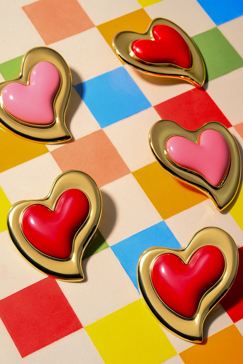 Liya HEARTFELT pink earrings featuring heart-shaped design and delicate craftsmanship, perfect for stylish accessories.
