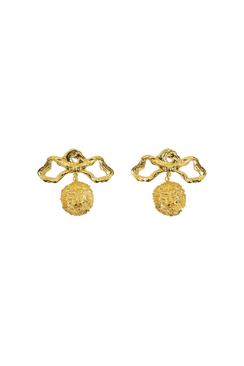 Natia x Lako lion-themed bow earrings with gold finish, featuring detailed lion face design on elegant bow-shaped earrings.