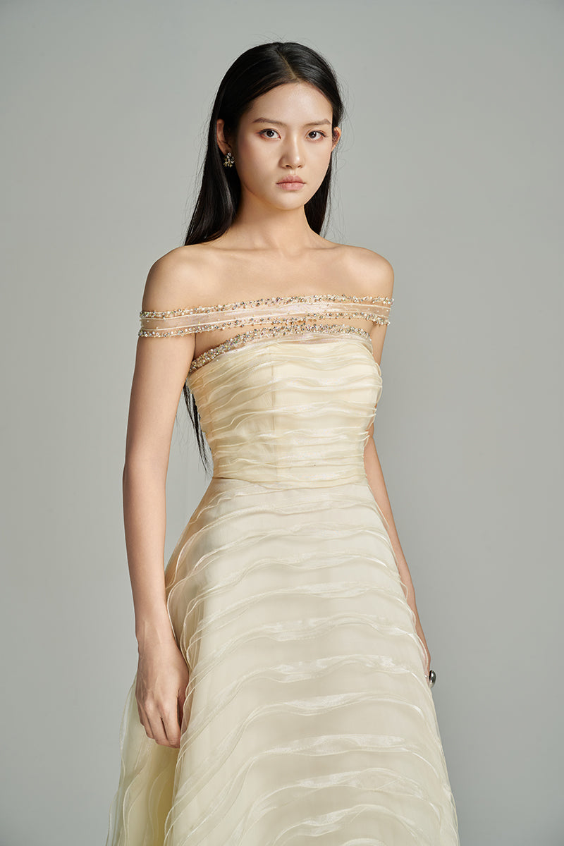 Beige off-shoulder organza gown by HAPPY CLOTHING from CULT MIA X HAPPY CLOTHING collection, flowing and elegant.