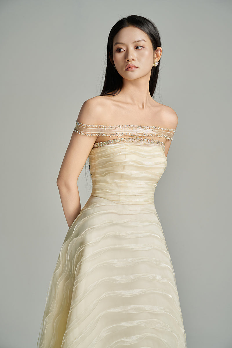 Beige CULT MIA X HAPPY CLOTHING off-shoulder organza gown, elegant long dress with flowing fabric and delicate design.