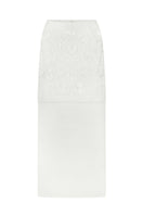 DELEGAN Naked Plakhta midi skirt in neutral fabric, showcasing its flowy design and midi length on a model.