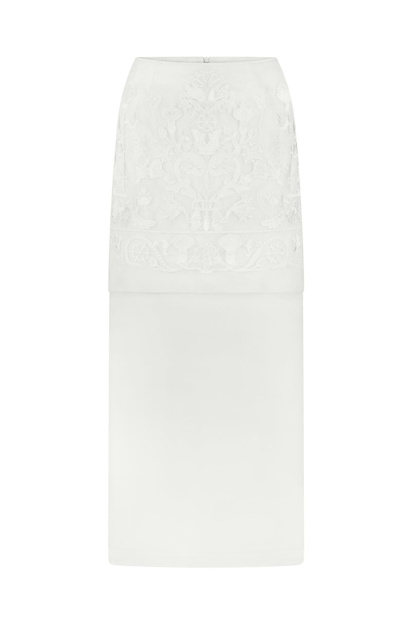 DELEGAN Naked Plakhta midi skirt in neutral fabric, showcasing its flowy design and midi length on a model.
