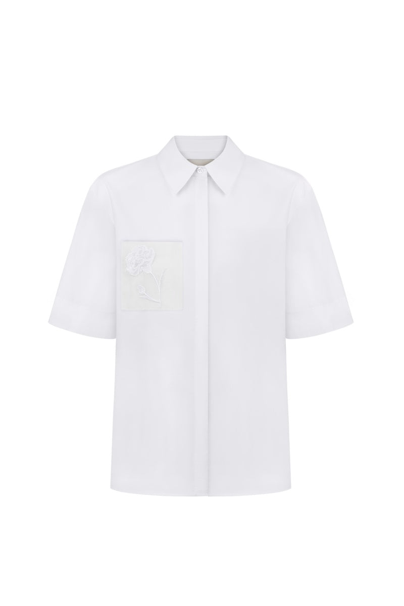 BlueDotTLE shirt by Delegan, stylish men's shirt with a classic collar and button-front design, shown in a close-up image.