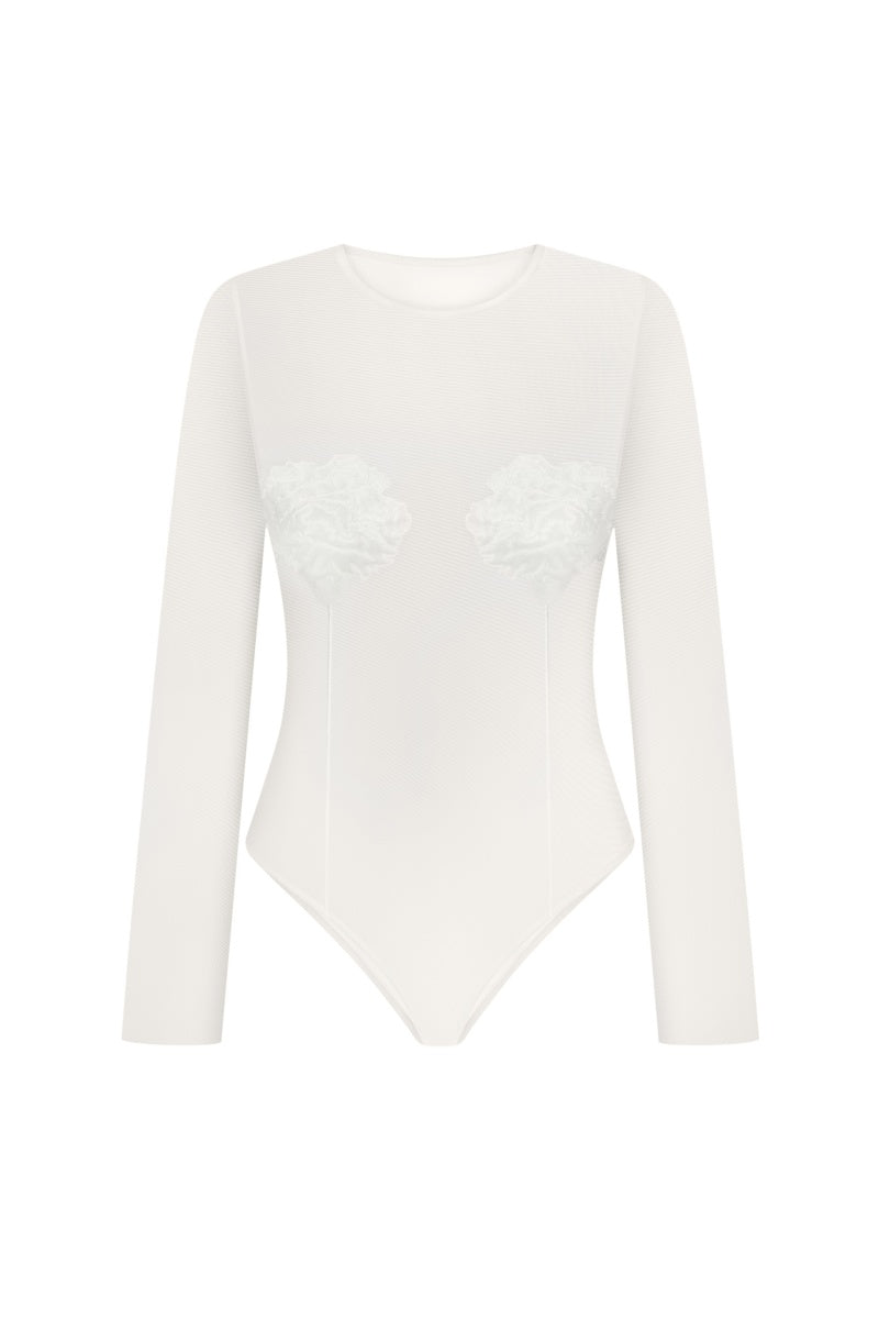 DELEGAN Milk long sleeve embroidered top shown in beige with intricate embroidery on the front and a relaxed fit.
