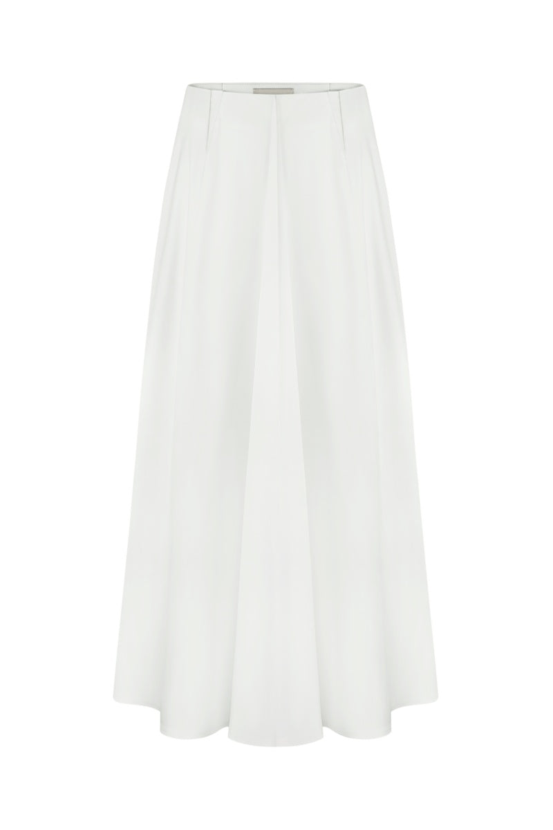 White cotton midi skirt by Delegan, shown with a flowing, knee-length design and a smooth, tailored fit.