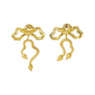Natia x Lako bow earrings with asymmetric snake design, featuring elegant gold-tone metal and intricate detailing.
