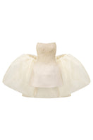 Beige beaded mini dress by I.H.F Studio featuring a fitted bustier style and intricate beadwork, perfect for elegant occasions.