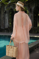 Melita Peach Fuzz silk pleated co-ords set by 21Six featuring a stylish shirt and matching pants in soft peach fabric.