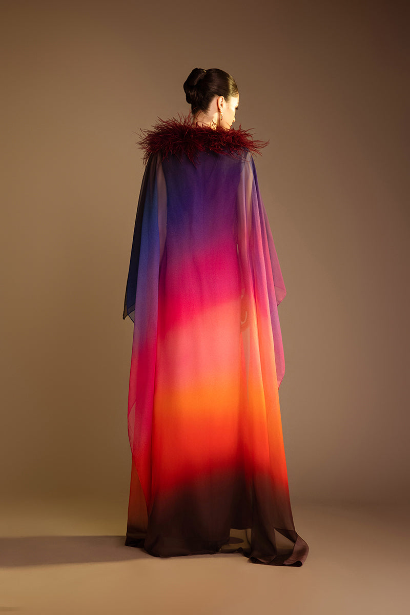 Valenciani pink printed gown with a detachable ostrich feather trim cape, elegant and flowing evening dress.