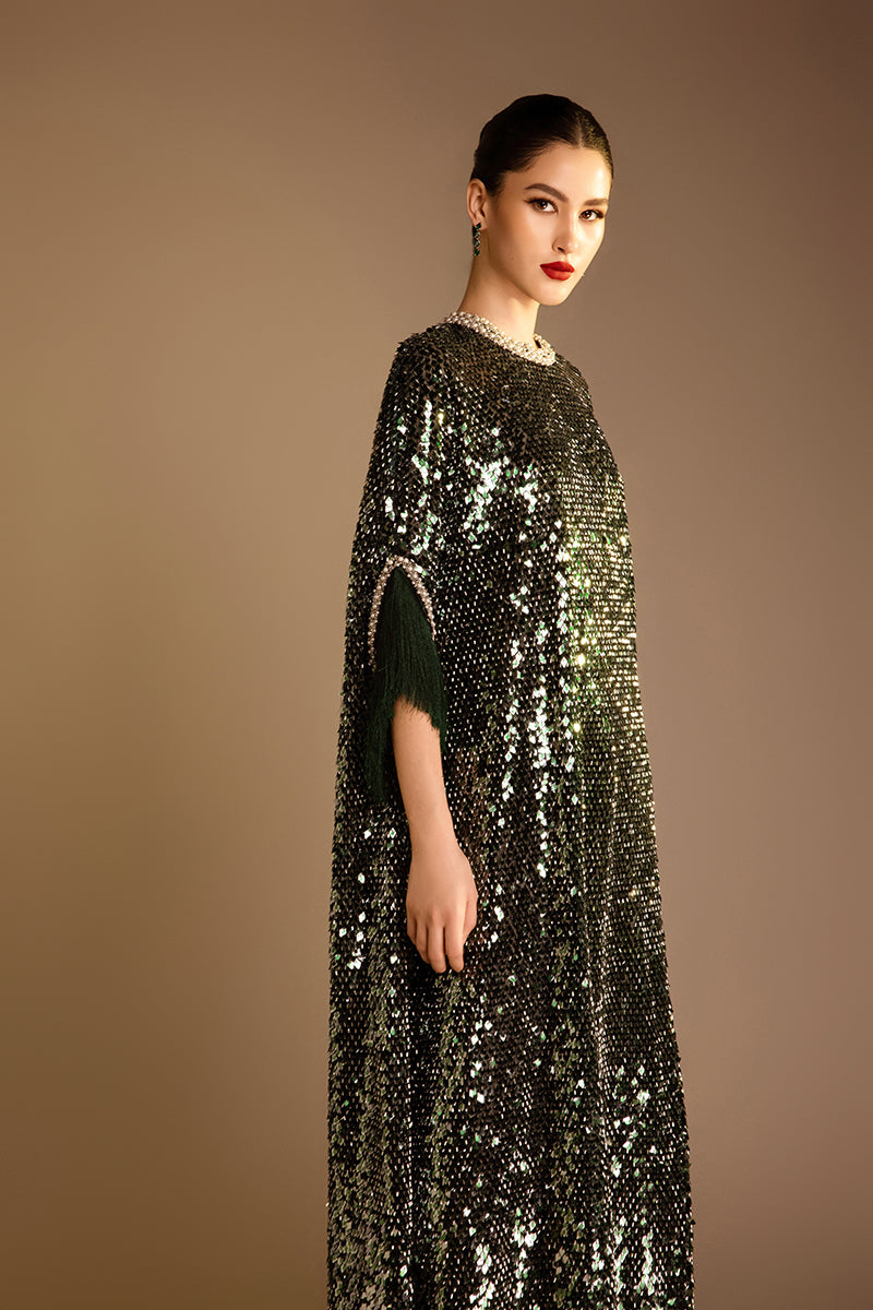 Green Valenciani pearl-trimmed sequin midi dress, showcasing elegant embellishments and a flowing silhouette.