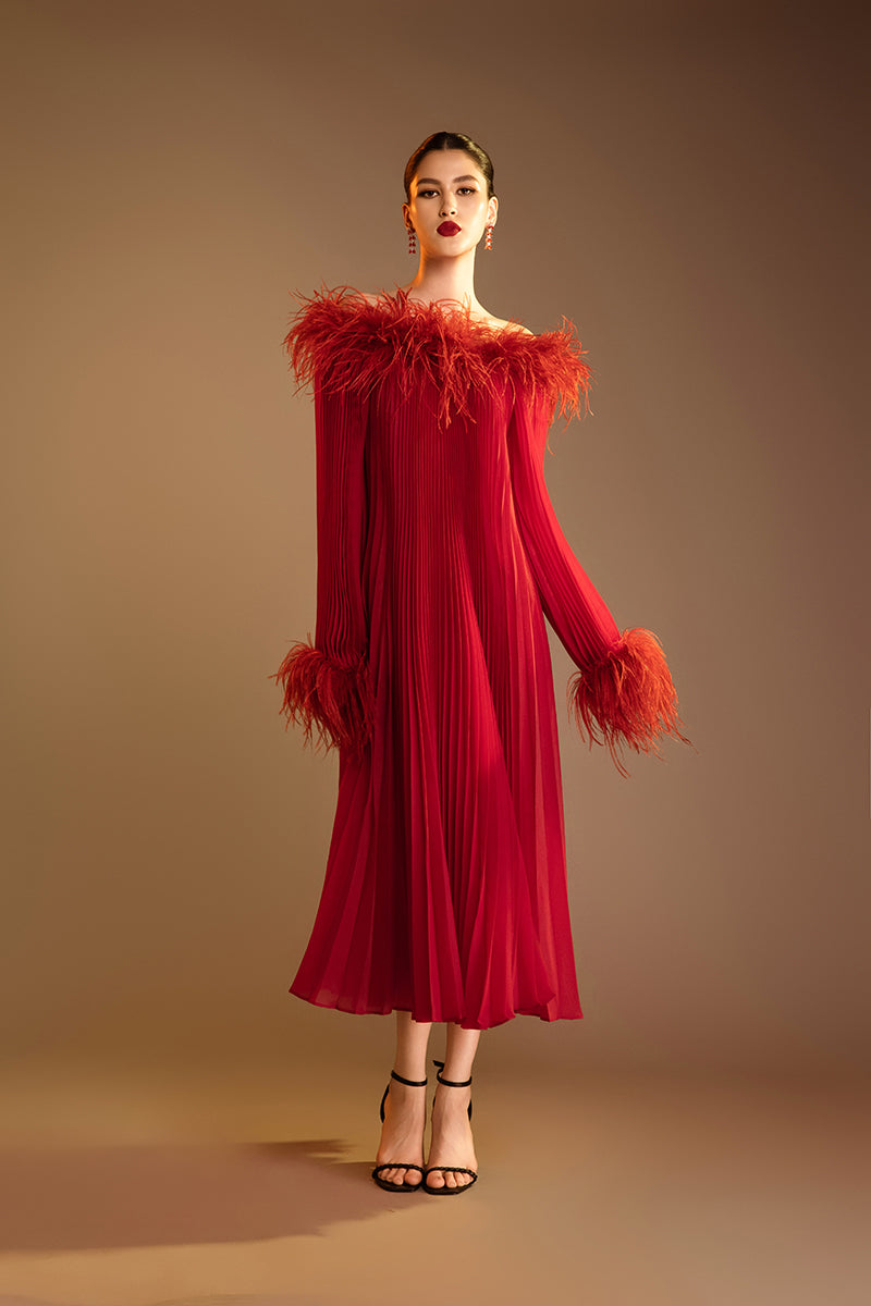Red Valenciani midi dress with ostrich feather trim and pleated design, elegant and stylish for special occasions.