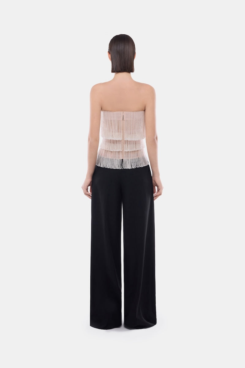 White crystal fringe tube top by Montsand, featuring a stylish design with sparkling crystal accents and a fitted sleeveless cut.