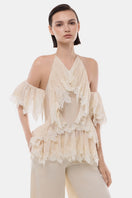 Ivory ruffled halter top by Montsand, featuring soft fabric, ruffle details, and a stylish halter neckline, perfect for summer wear.