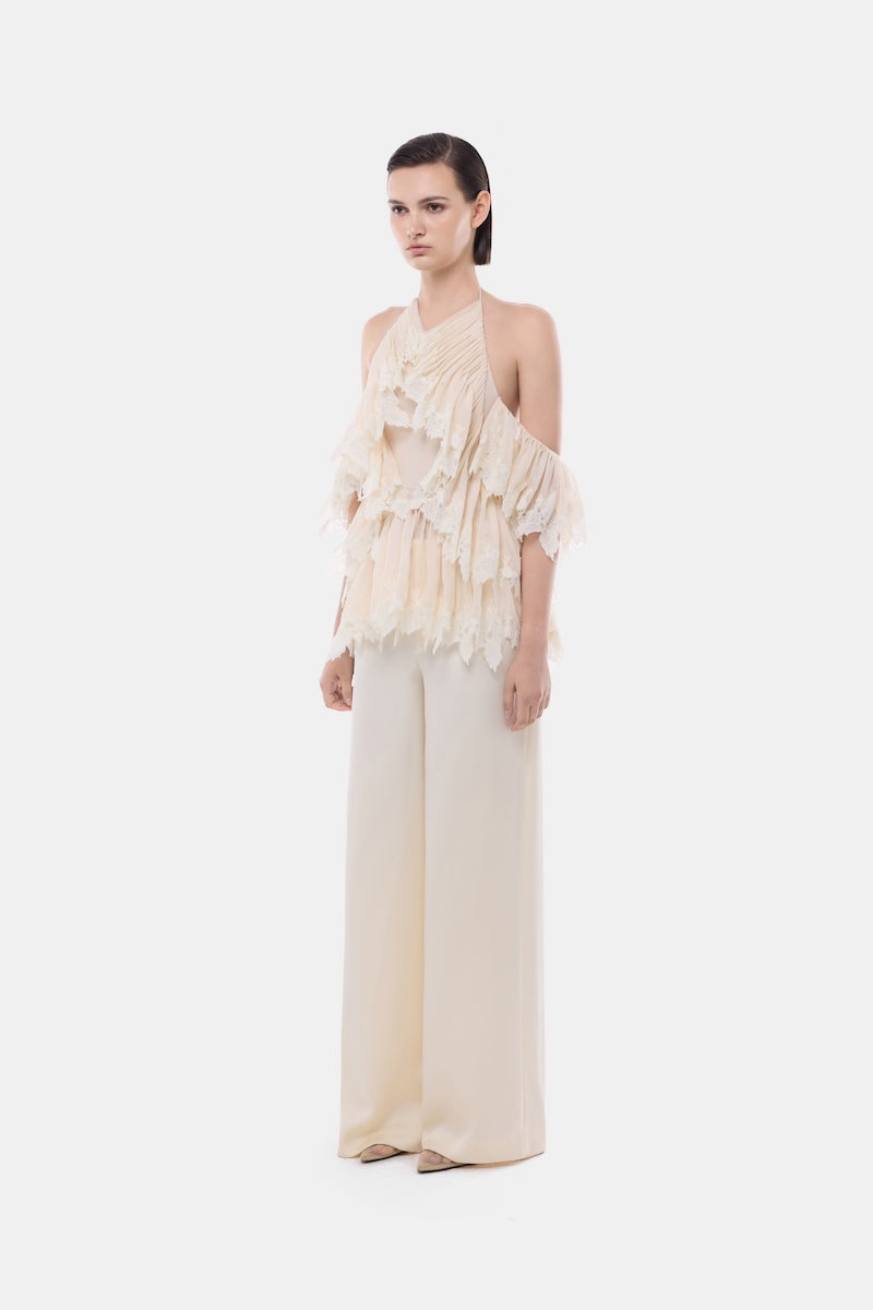Ivory wide-leg trousers by Montsand, featuring a relaxed fit and high waist, shown on a model against a neutral background.