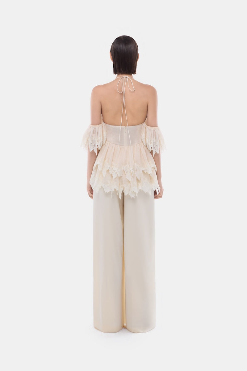Montsand ivory wide leg trousers, stylish pants with a relaxed fit, shown on a model with a neutral background.