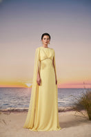 A pale yellow CULT MIA X 21Six Mira chiffon gown with flowing fabric and elegant design, perfect for formal occasions.