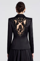 Black TAFFETA MIKADO peplum gown by Tracy Studio, featuring a fitted bodice and elegant peplum detail.