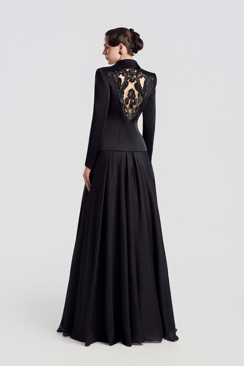 Black Taffeta Mikado peplum maxi dress by Tracy Studio, featuring a fitted bodice and elegant peplum detail.