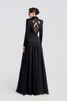 Black TAFFETA MIKADO peplum gown by Tracy Studio, featuring a fitted bodice and elegant peplum detail.