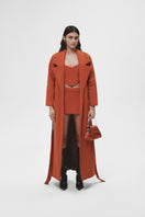 JC Pajares long coat with side pockets, stylish outerwear in neutral fabric, featuring a classic design and functional side pockets.
