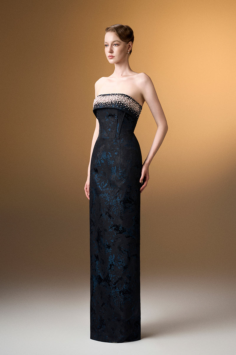 Blue strapless ballgown in rose design brocade by I.H.F, featuring elegant fabric and a flowing silhouette.