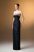 Blue strapless ballgown in rose design brocade by I.H.F, featuring elegant fabric and a flowing silhouette.