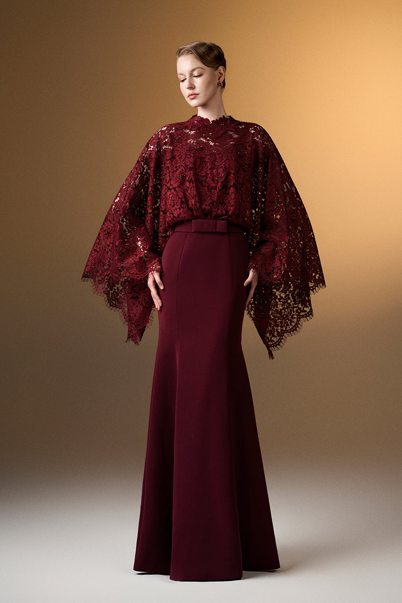 Dark red I.H.F mermaid gown with kimono sleeves, crepe fabric, and French lace detailing.