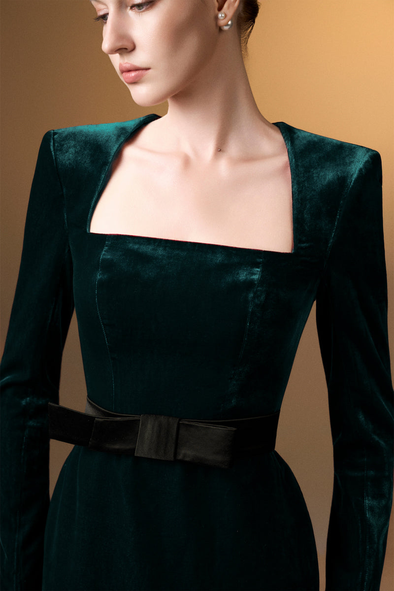 Green grain velvet trapeze neck gown with long sleeves by I.H.F, elegant and flowing silhouette suitable for formal occasions.