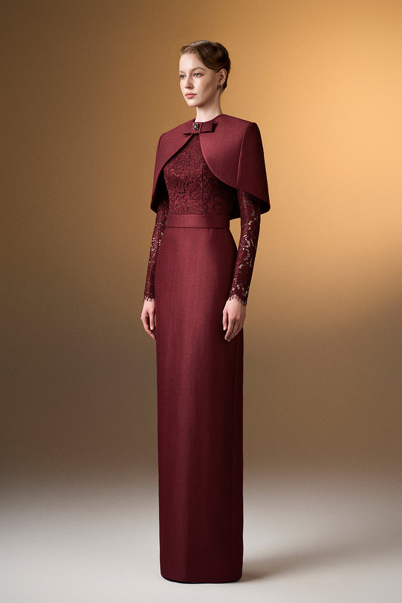 Dark red I.H.F gown with round neck, long sleeves, and a stylish mini cape, designed for elegant occasions.