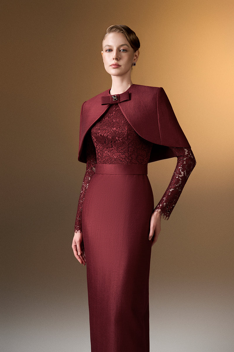 Dark red I.H.F gown with round neck, long sleeves, and mini cape, featuring a stylish, elegant design.